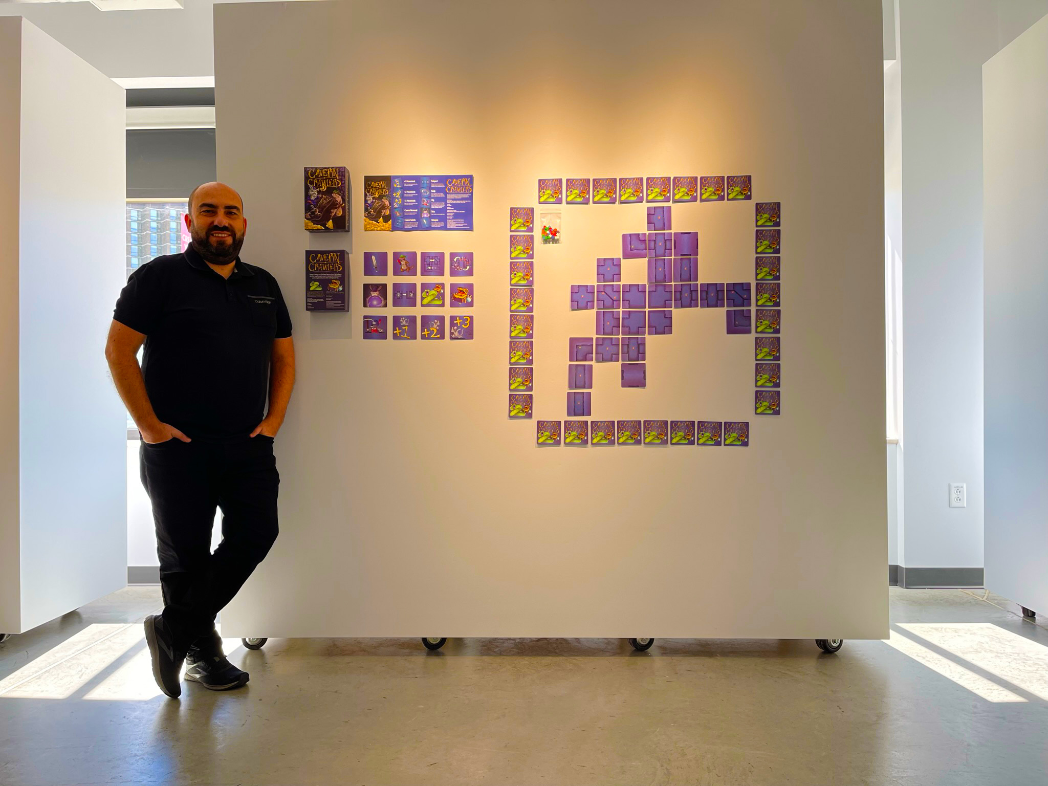 Dr. Şengün exhibiting his board game design work in Illinois State University's CTK Visions exhibition.'